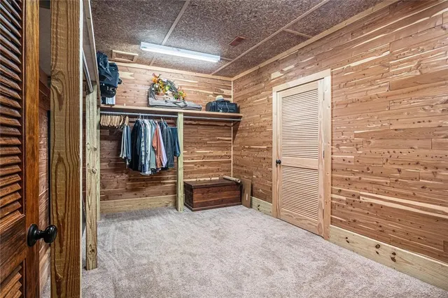 a view of backyard with deck and outdoor seating