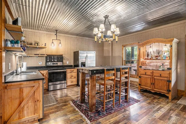a view of a patio with a table and chairs