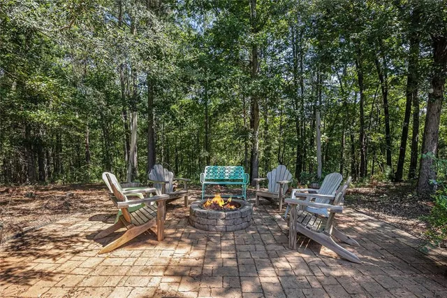 a view of a green field with lots of bushes