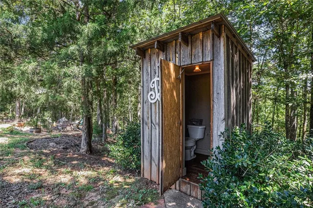 a view of a green field with an ocean