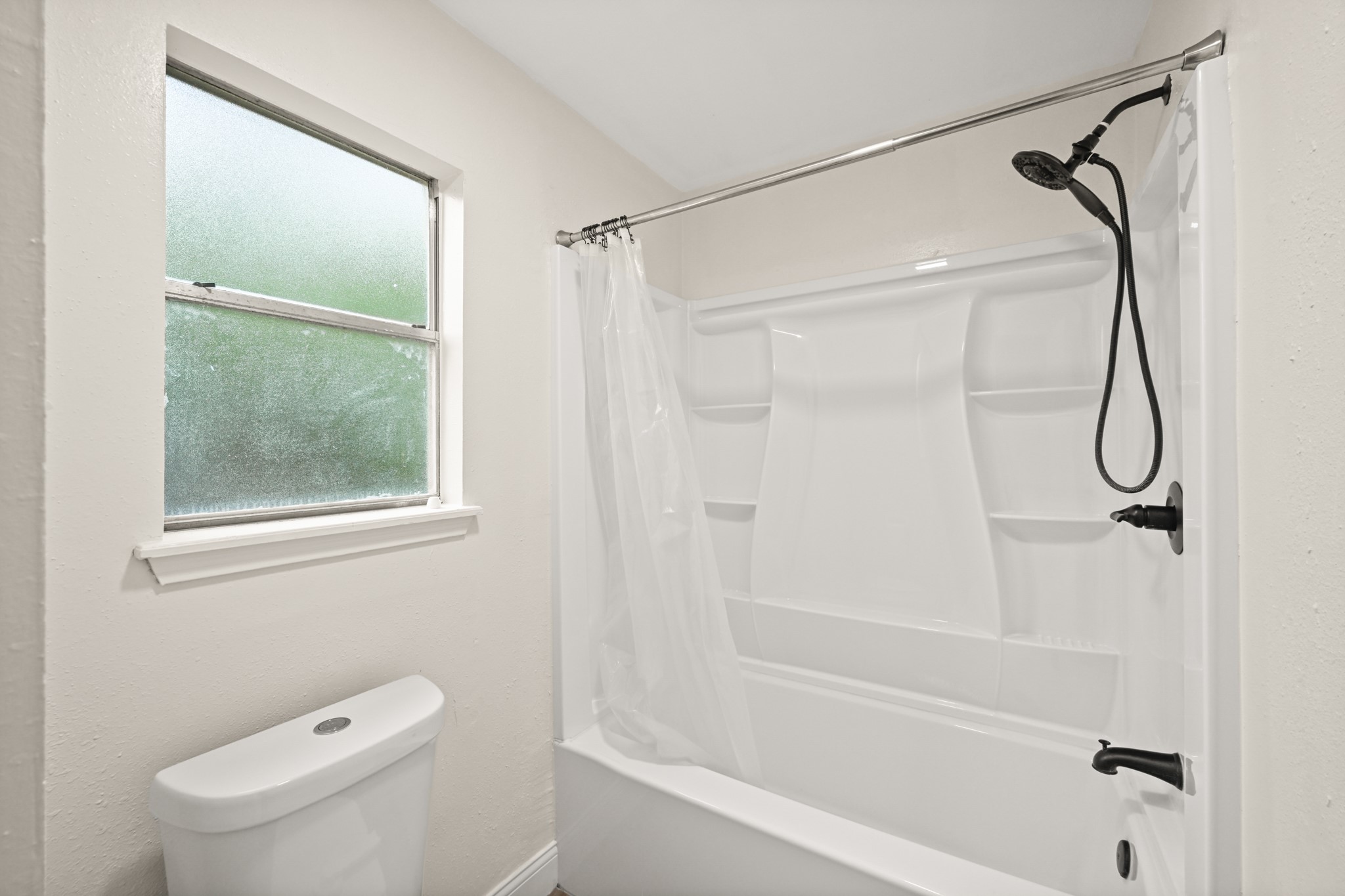 7618 Fountaingrove Lane Spring, TX 77379 - Photo 14 of 20 Spacious shower with modern tile and clean, updated finishes.