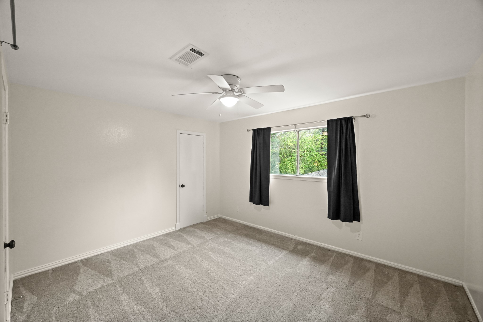 7618 Fountaingrove Lane Spring, TX 77379 - Photo 18 of 20 Another generous secondary bedroom with natural light and flexible use for guests, kids, or an office.