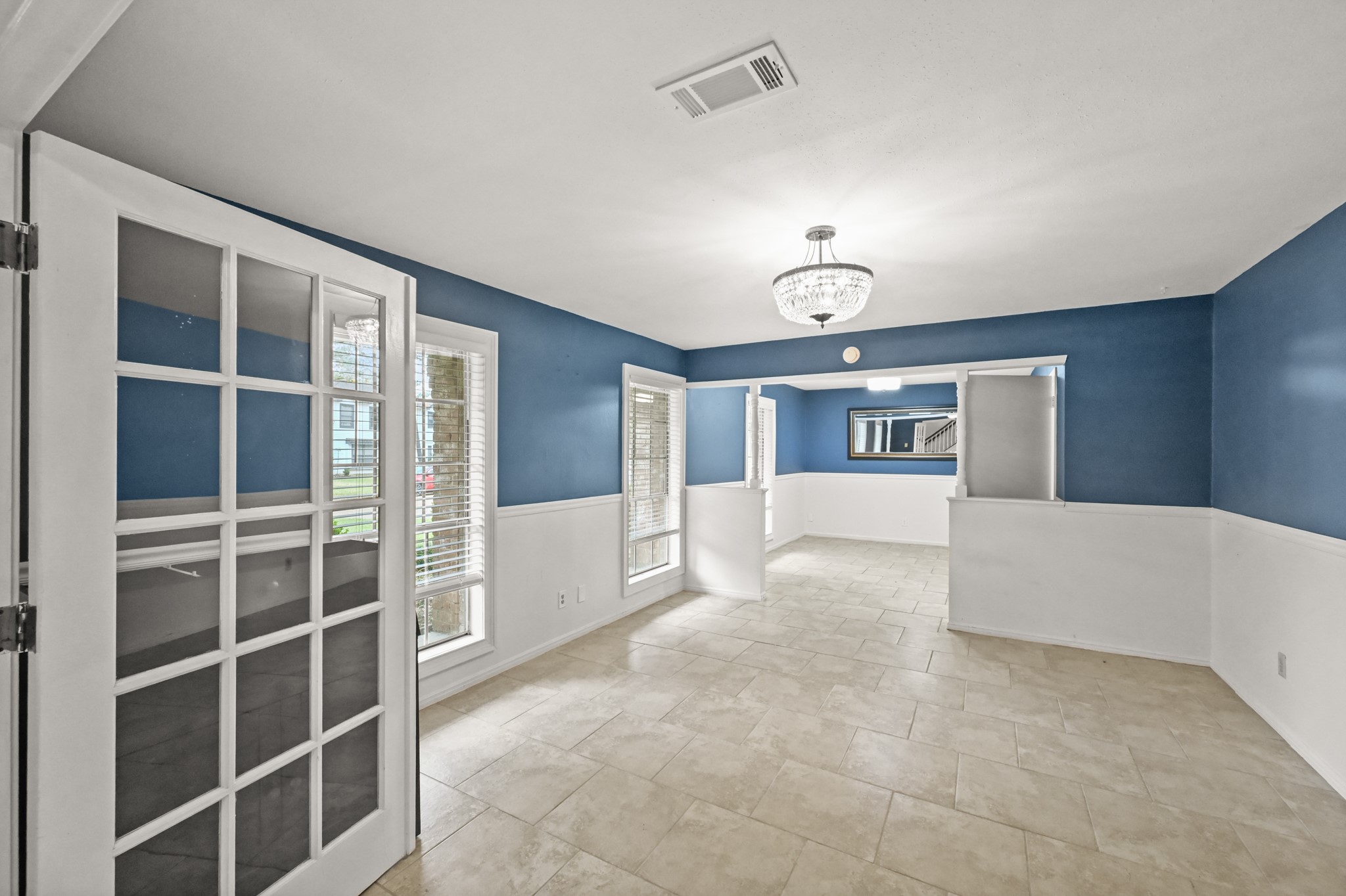 7618 Fountaingrove Lane Spring, TX 77379 - Photo 4 of 20 Bright and versatile, this front room features natural light and the perfect layout for multiple uses to fit your lifestyle.