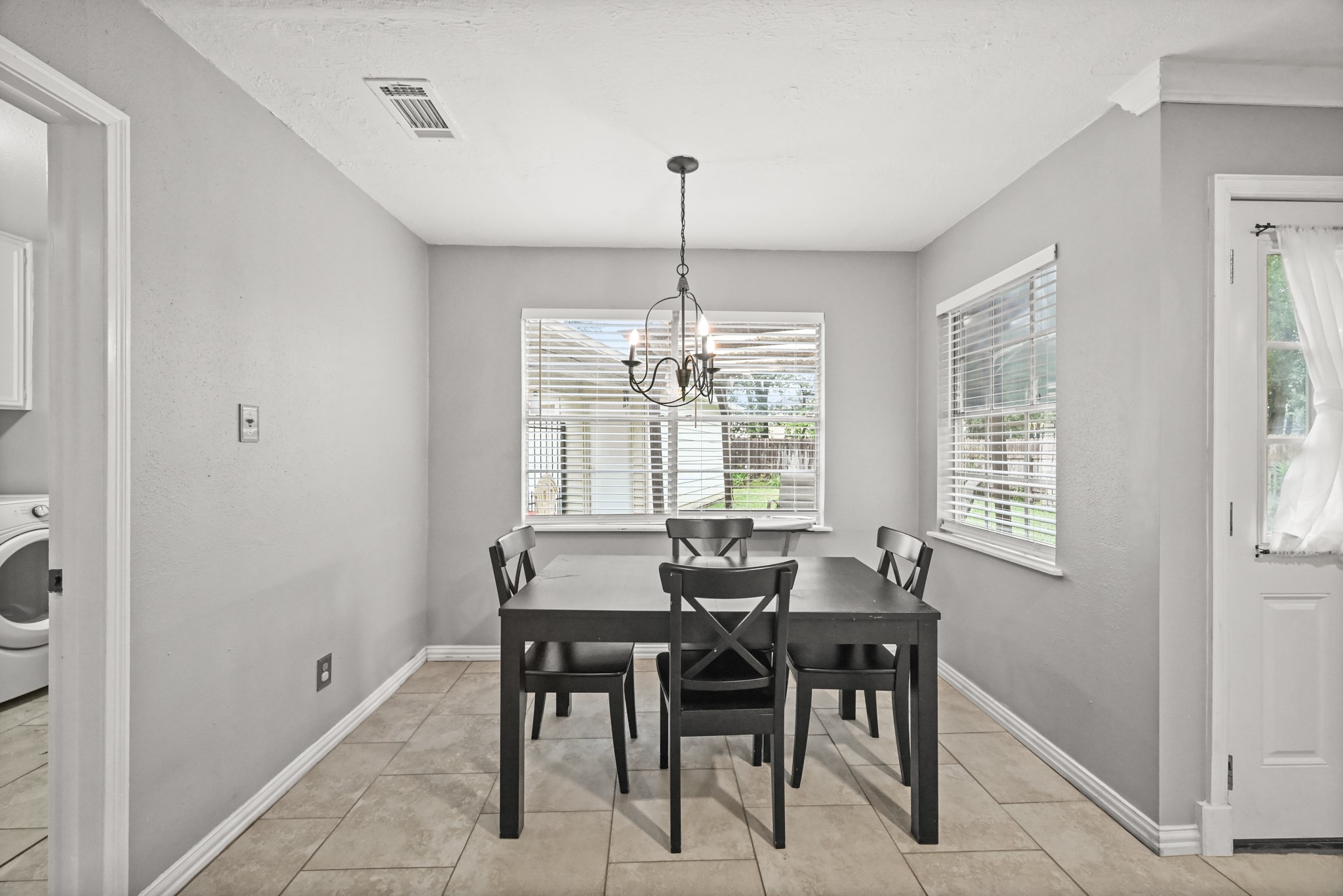 7618 Fountaingrove Lane Spring, TX 77379 - Photo 7 of 20 Light-filled breakfast nook with bar seating and open access to the kitchen and living room for easy entertaining.