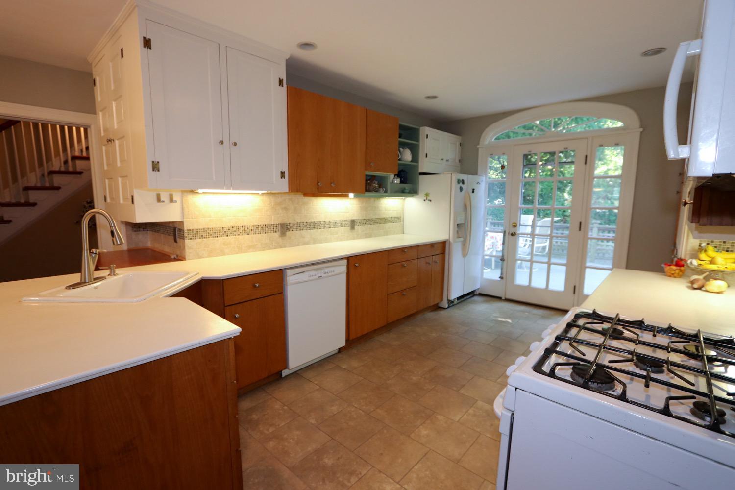2701 Alden Road Bryn Athyn, PA 19006 - Photo 28 of 105 a kitchen with stainless steel appliances a sink stove and cabinets
