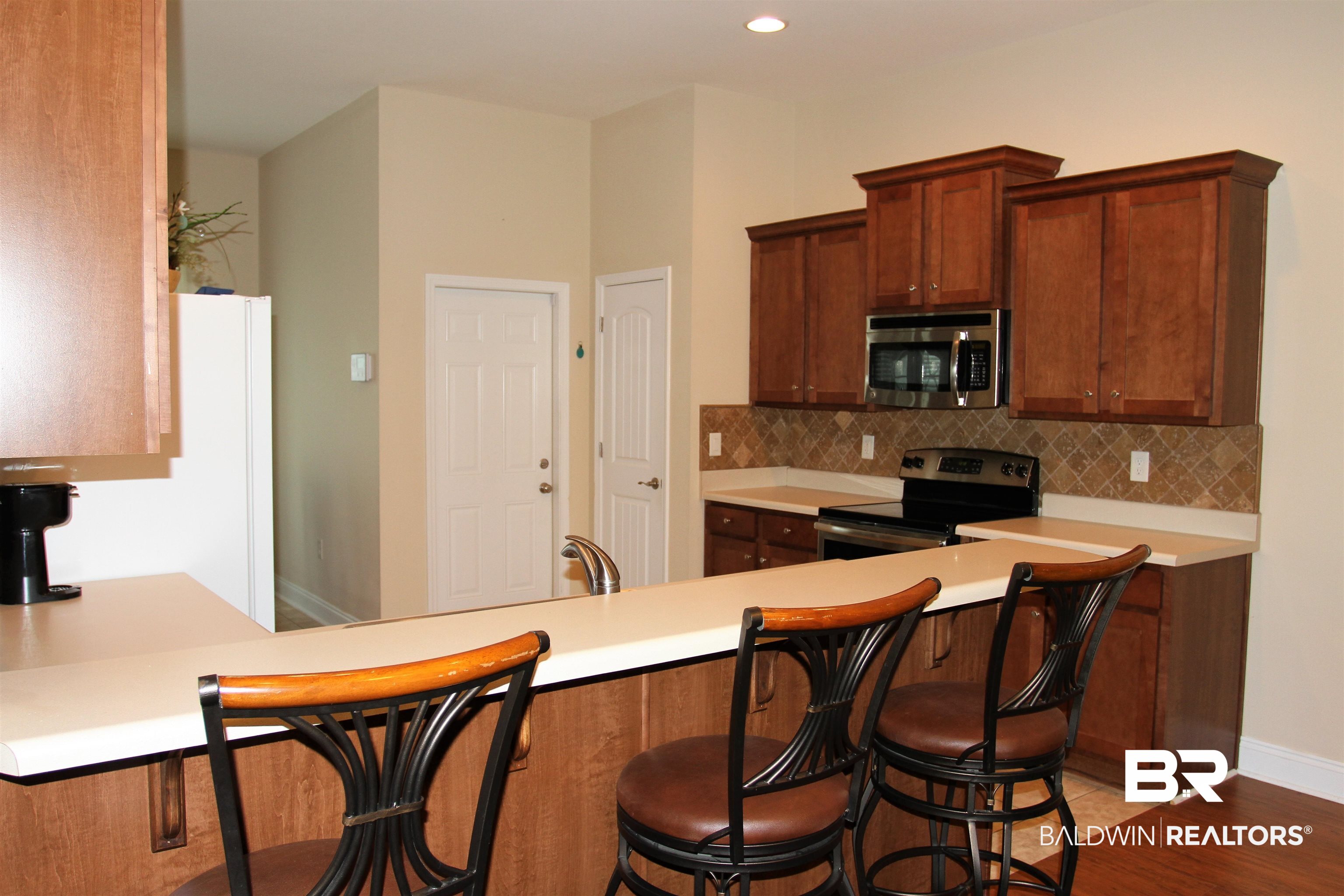 14620 Silvermere Drive Foley, AL 36535 - Photo 7 of 27 Eat in bar area.