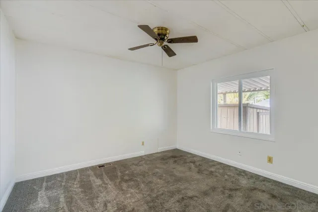 a view of empty room with windows