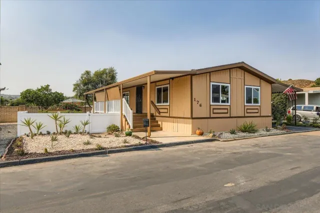 a front view of a house with a ocean view