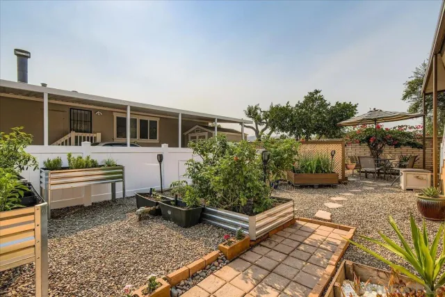 a dining room with furniture a rug and wooden floor