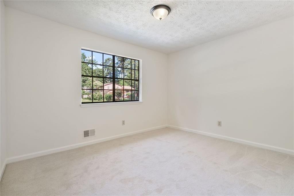 4534 Tifton Court Powder Springs, GA 30127 - Photo 15 of 23 an empty room with a window