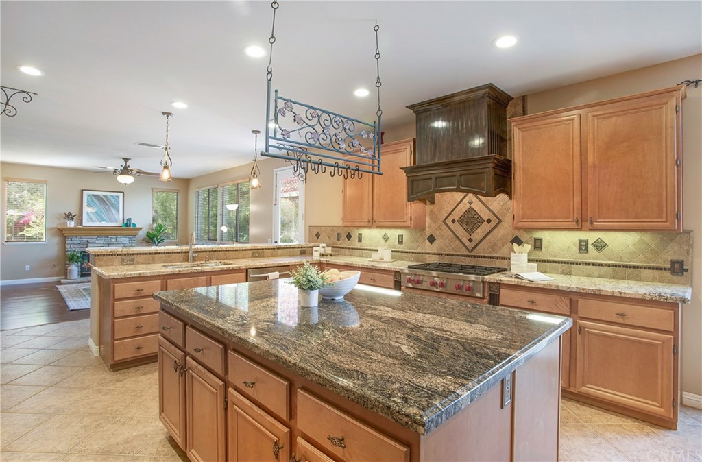 17005 Limetree Lane Riverside, CA 92503 - Photo 1 of 1 a kitchen with a stove a counter space a sink and cabinets