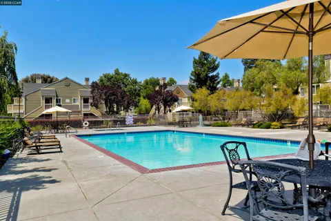 a view of a swimming pool with a patio