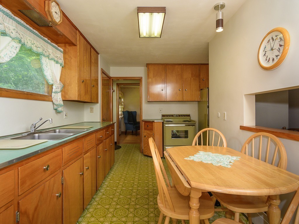 107 Mine Brook Road Webster, MA 01570 - Photo 11 of 30 a large kitchen with a table and chairs