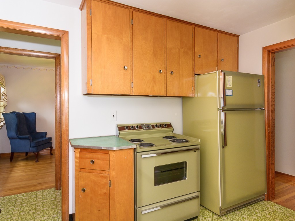107 Mine Brook Road Webster, MA 01570 - Photo 12 of 30 a kitchen with a stove and a refrigerator