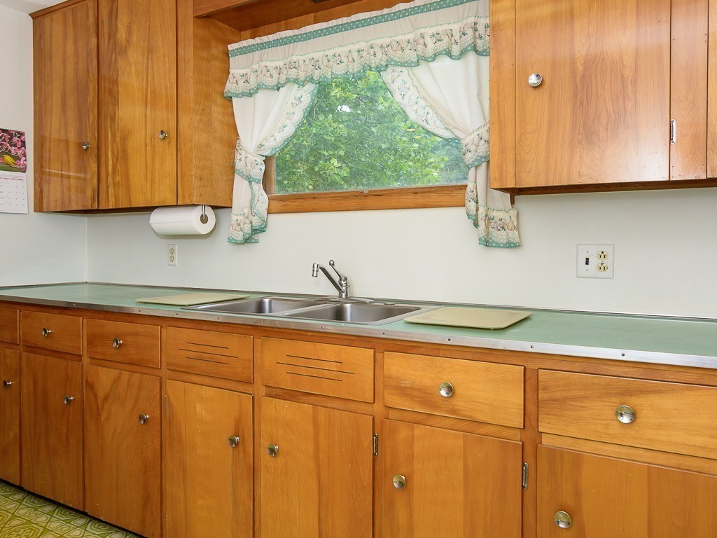 107 Mine Brook Road Webster, MA 01570 - Photo 13 of 30 a kitchen with stainless steel appliances granite countertop white cabinets and a sink