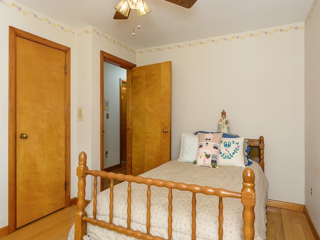 107 Mine Brook Road Webster, MA 01570 - Photo 18 of 30 a bedroom with a bed and wooden floor