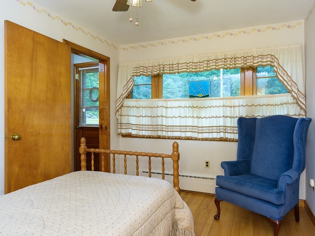 107 Mine Brook Road Webster, MA 01570 - Photo 19 of 30 a living room with a bed and furniture