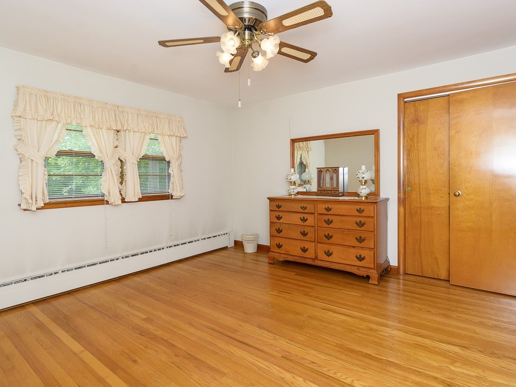 107 Mine Brook Road Webster, MA 01570 - Photo 26 of 30 wooden floor in a room with a dresser and couch