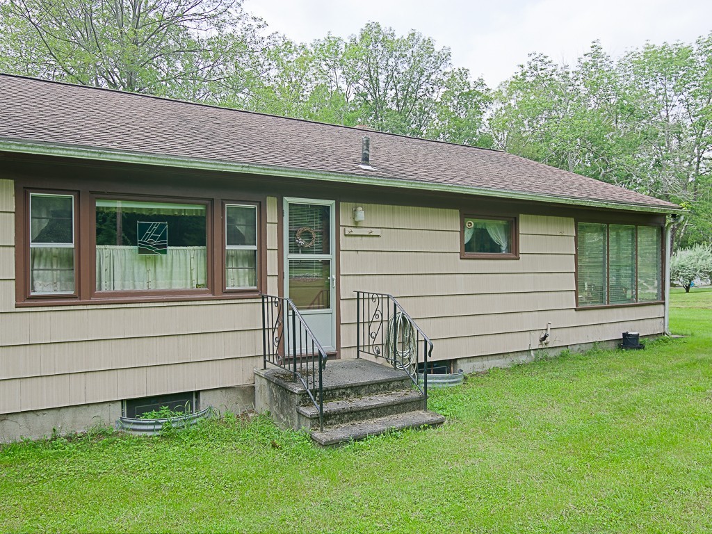 107 Mine Brook Road Webster, MA 01570 - Photo 30 of 30 a front view of a house with a garden