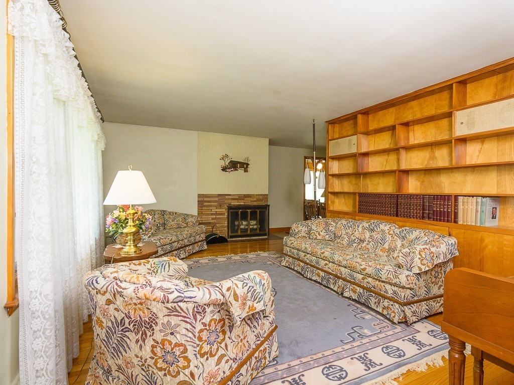 107 Mine Brook Road Webster, MA 01570 - Photo 4 of 30 a bed room with a bed and a fireplace