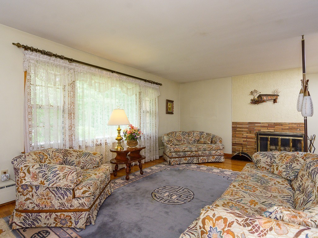 107 Mine Brook Road Webster, MA 01570 - Photo 5 of 30 a bedroom with furniture and a fireplace
