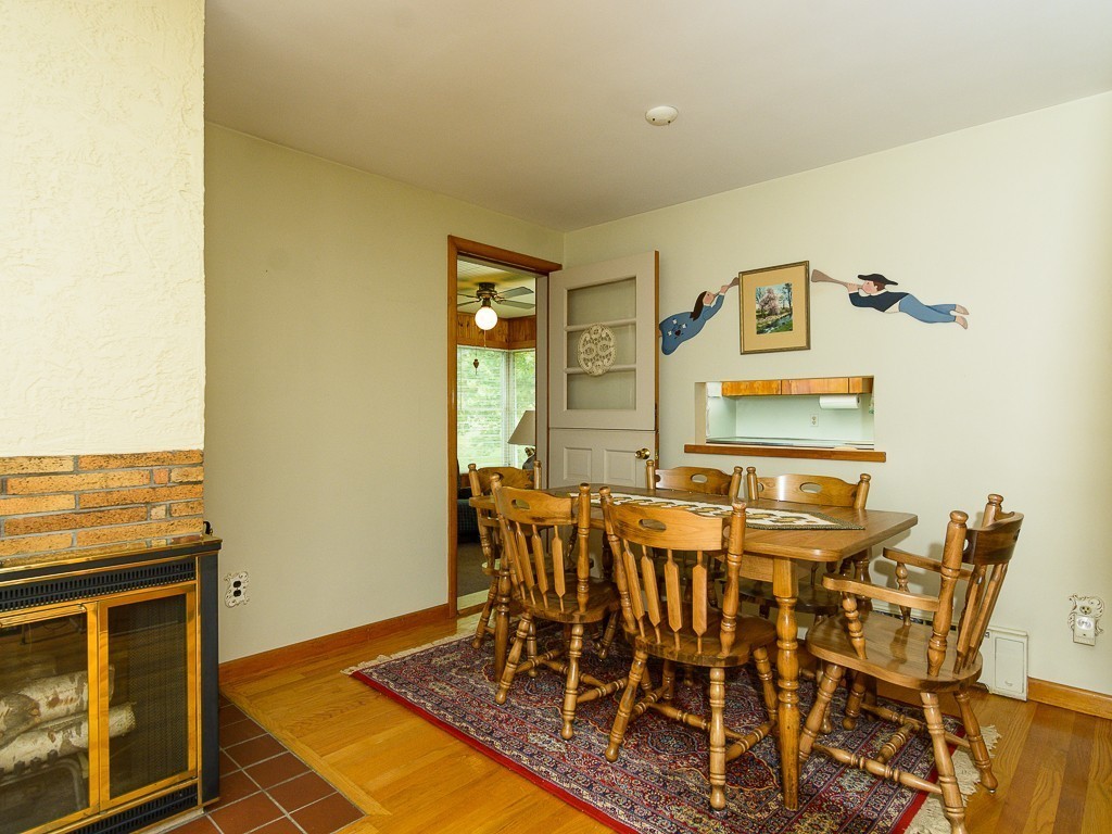 107 Mine Brook Road Webster, MA 01570 - Photo 8 of 30 a dining room with chairs and wooden floor