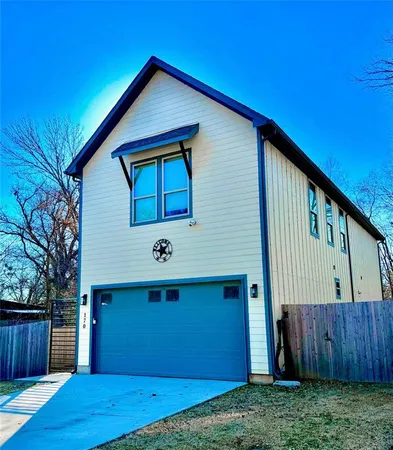 a front view of house with backyard