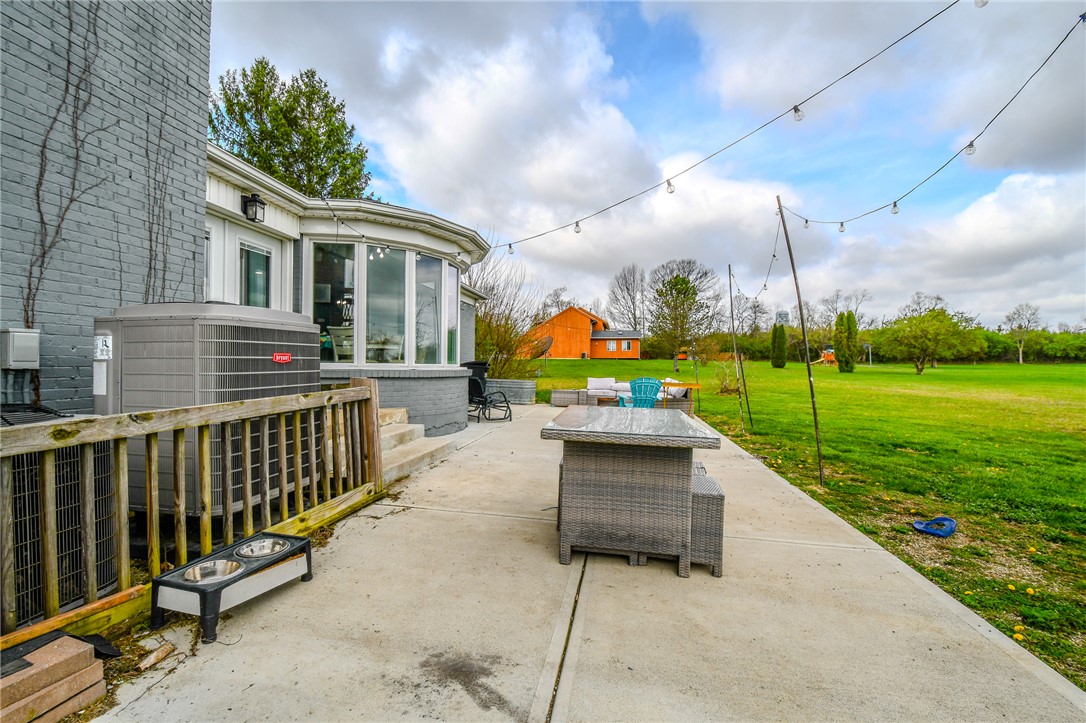 6169 Dayton Farmersville Road Dayton, OH 45417 - Photo 50 of 64 This expansive outdoor area features a concrete patio, perfect for enjoying the spacious yard.