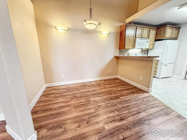 a view of a kitchen from the hallway