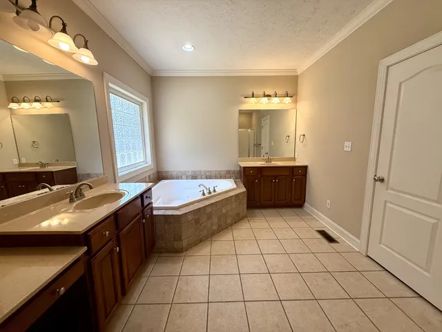a bathroom with a sink vanity and mirror