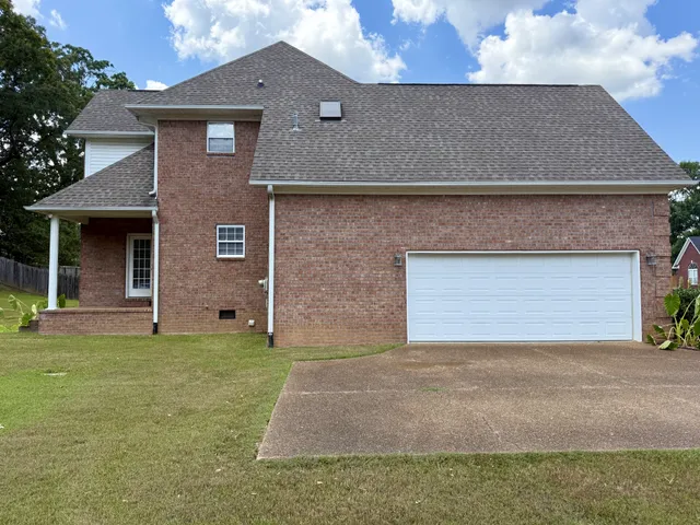 a view of a swimming pool with an outdoor space and seating area