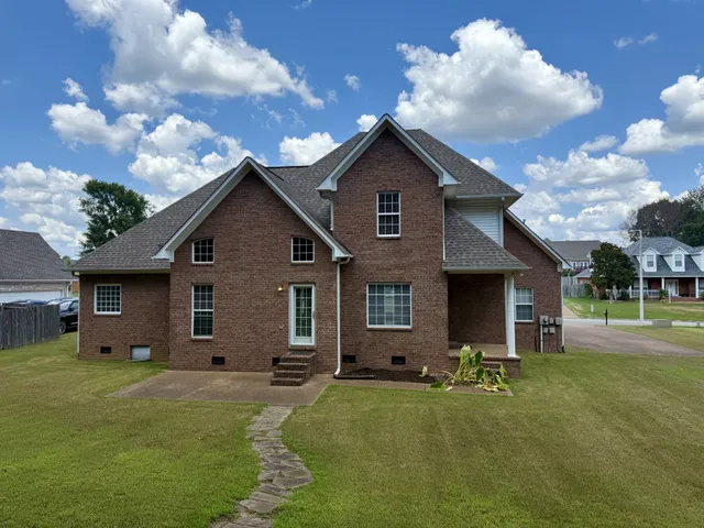 a view of a house with a big yard