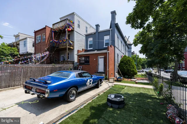 a car parked in front of a house