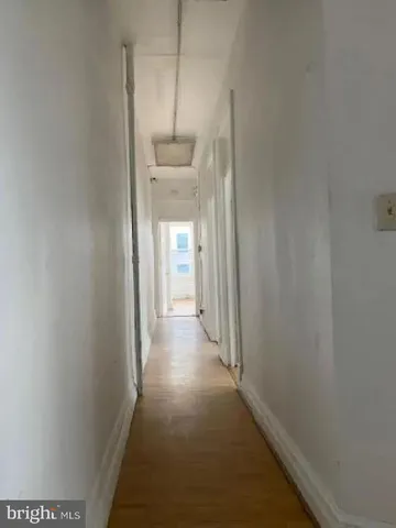 a view of a hallway with a white walls