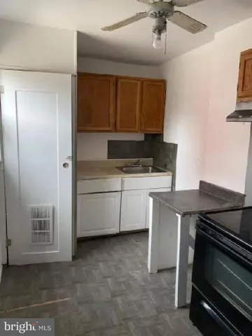 a kitchen with a stove and a microwave