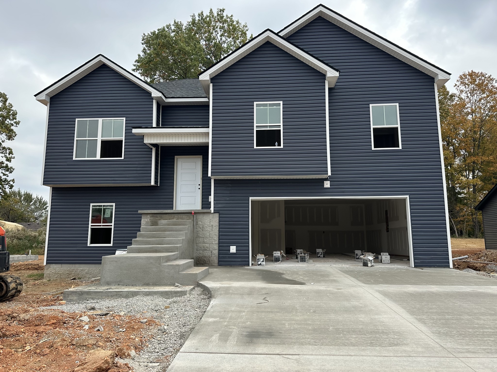 233 Wayne Hall Road Clarksville, TN 37040 - Photo 1 of 14 a front view of a house with a yard and garage