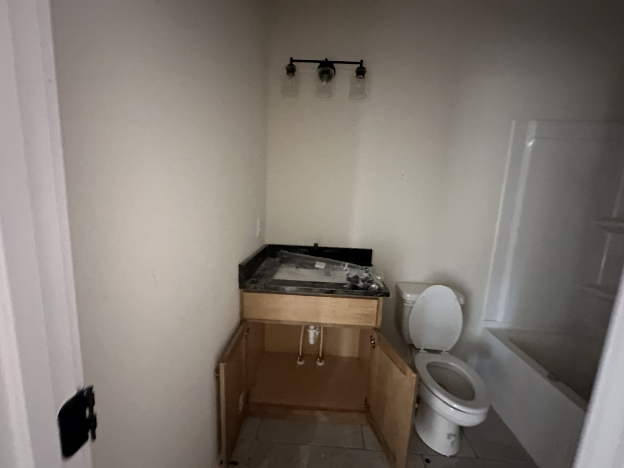 233 Wayne Hall Road Clarksville, TN 37040 - Photo 11 of 14 a bathroom with a toilet and a sink