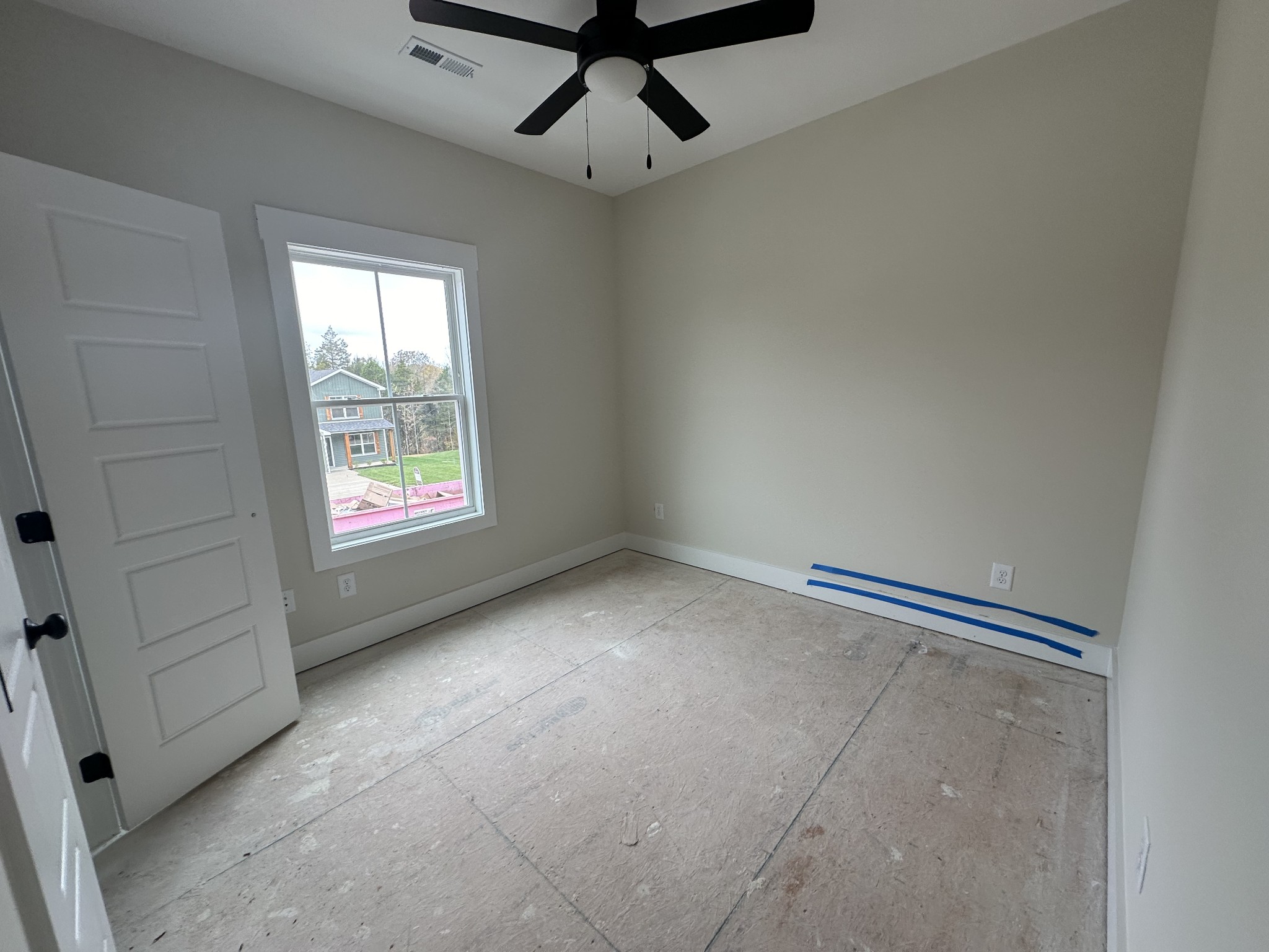 233 Wayne Hall Road Clarksville, TN 37040 - Photo 14 of 14 an empty room with windows and ceiling fan