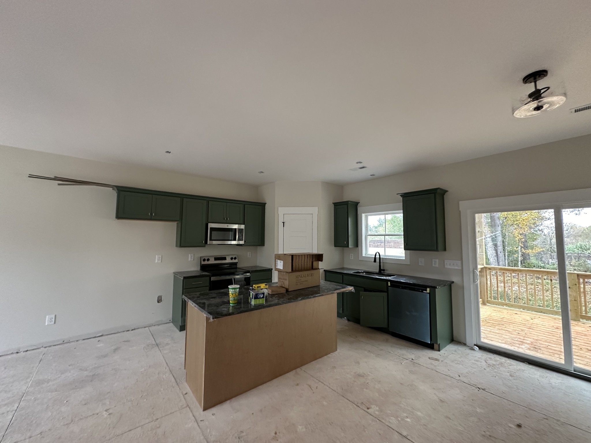 233 Wayne Hall Road Clarksville, TN 37040 - Photo 8 of 14 a kitchen with stainless steel appliances granite countertop a stove a sink and a refrigerator