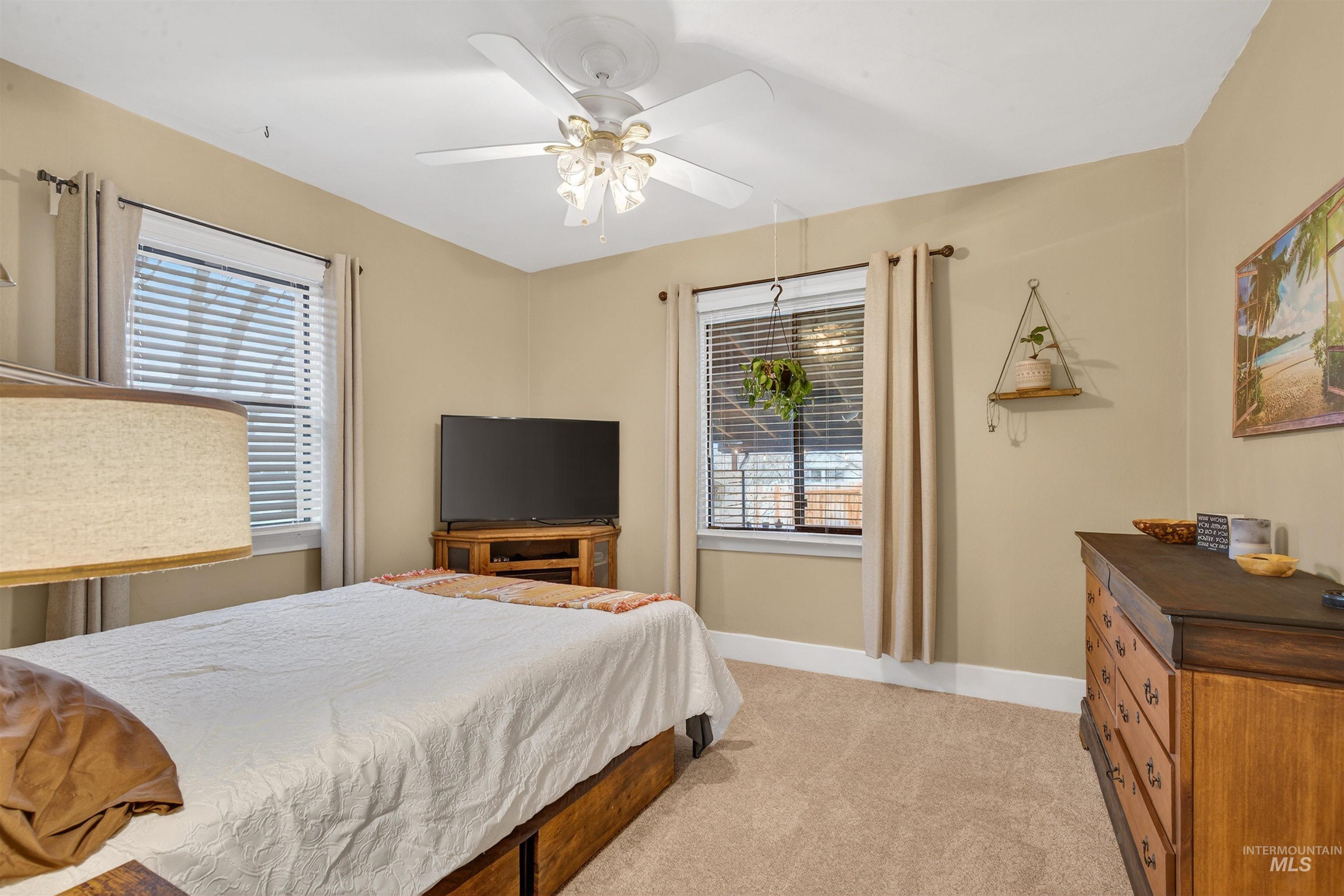 1021 11th Avenue Lewiston, ID 83501 - Photo 17 of 41 Bedroom featuring light carpet and ceiling fan