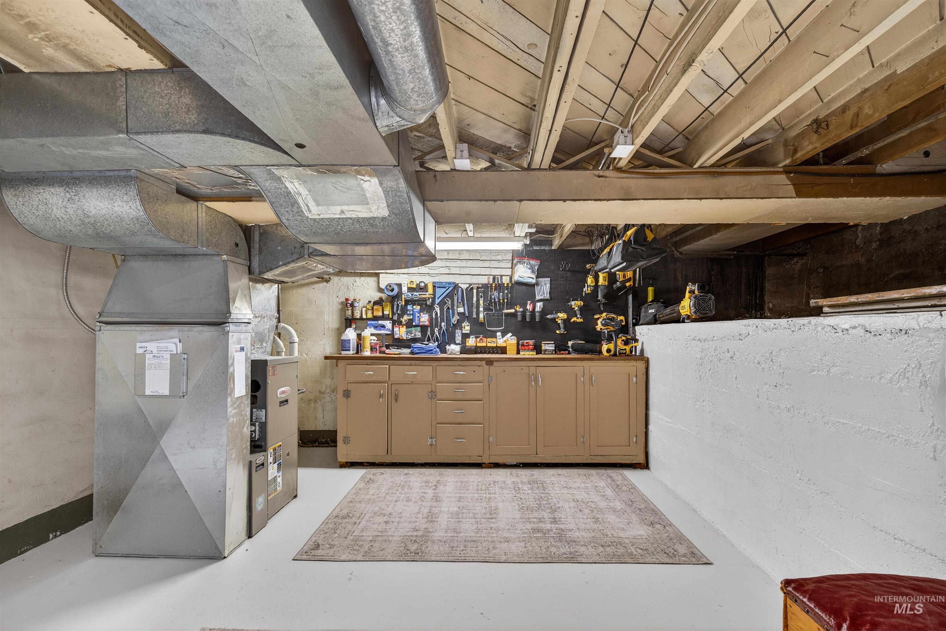 1021 11th Avenue Lewiston, ID 83501 - Photo 28 of 41 Unfinished below grade area featuring heating unit and a workshop area