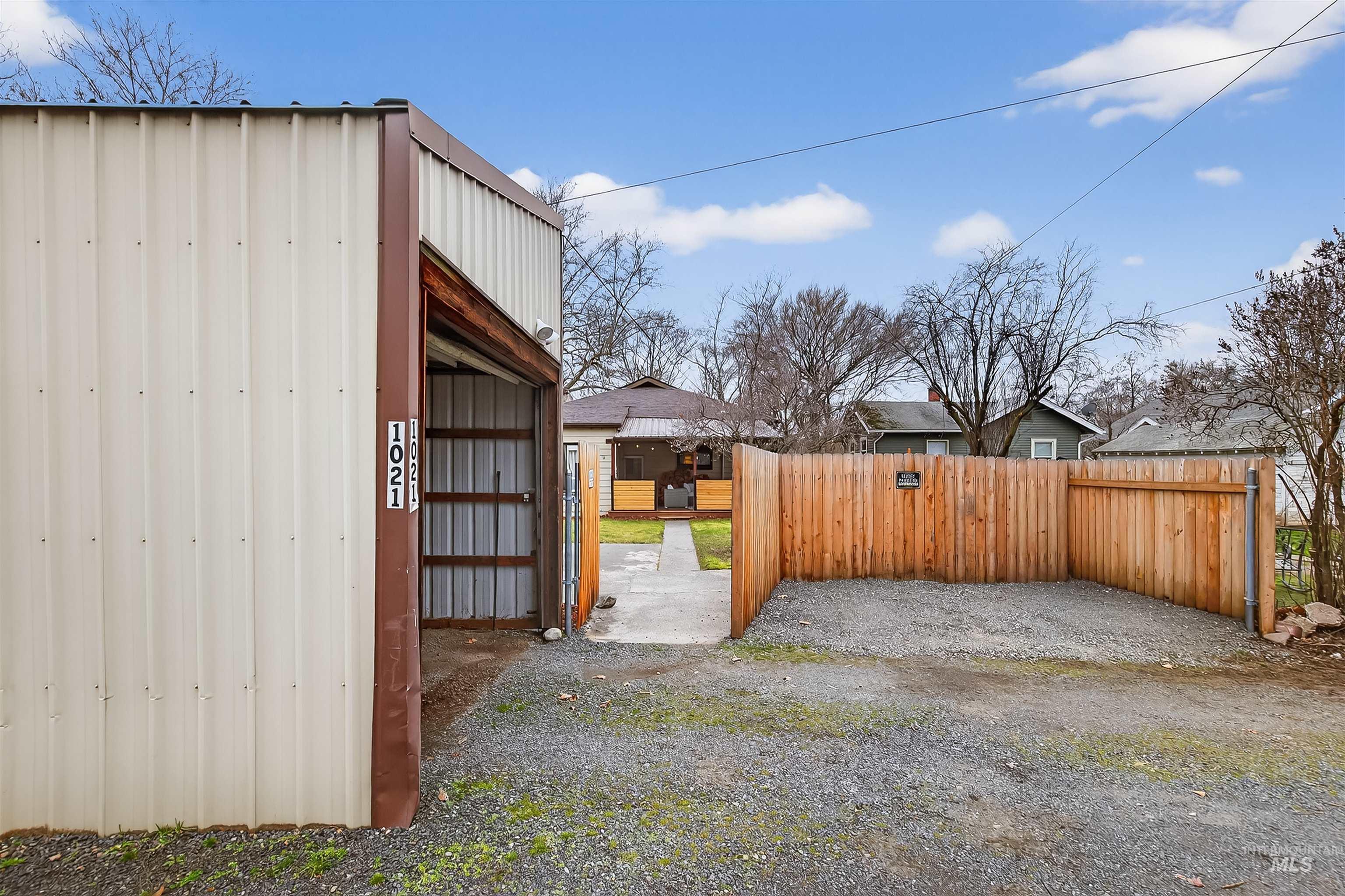 1021 11th Avenue Lewiston, ID 83501 - Photo 36 of 41 View of yard with a gate and an outbuilding