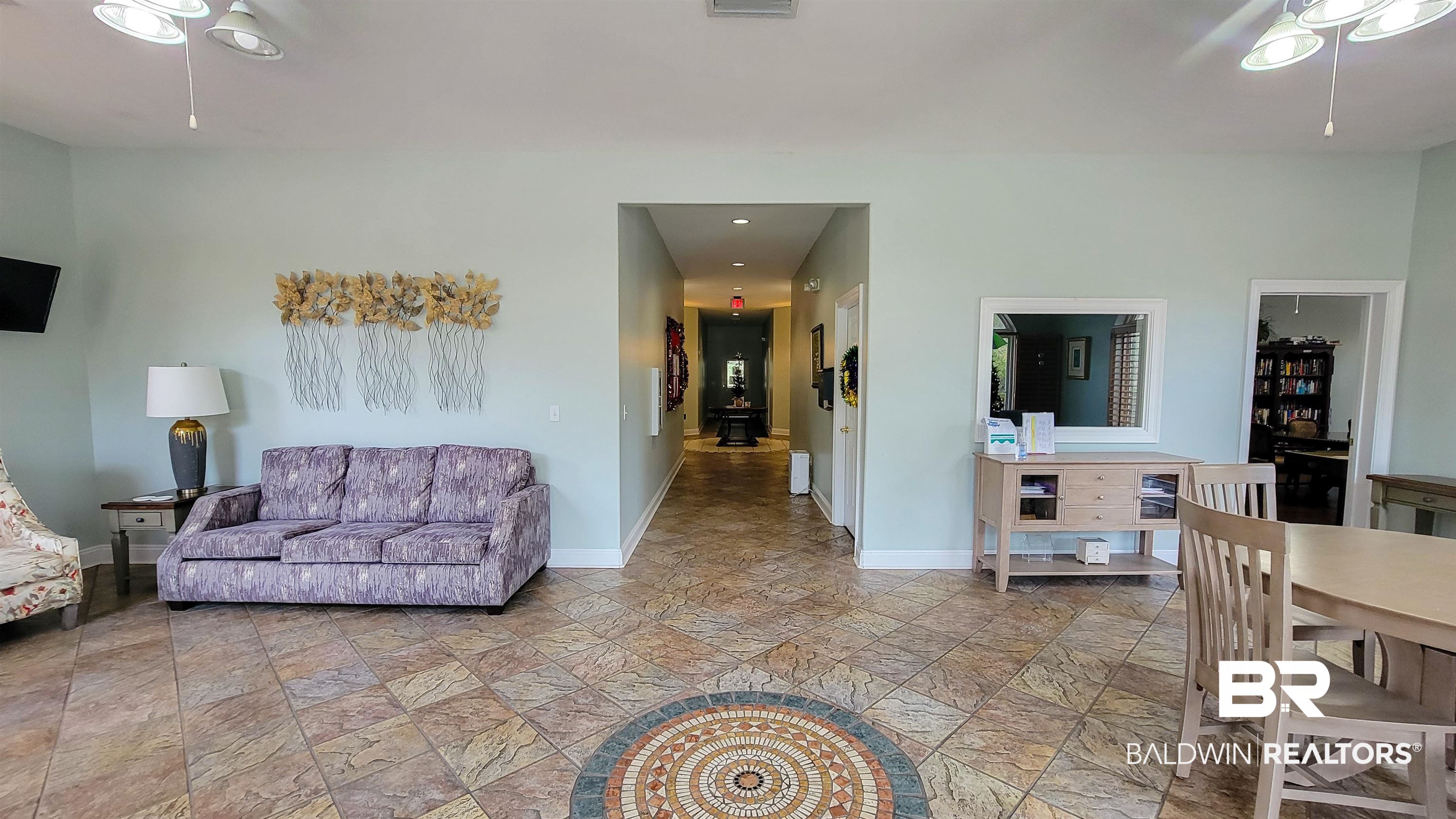 214 Hemingway Loop Foley, AL 36535 - Photo 62 of 67 Living area featuring stone tile floors and a ceiling fan