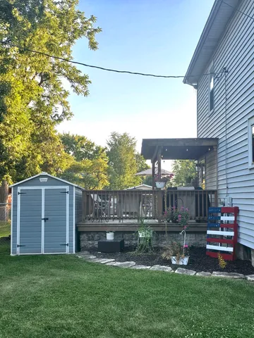 a view of a backyard with a garden and plants