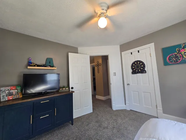 a bed room with a bed and a window