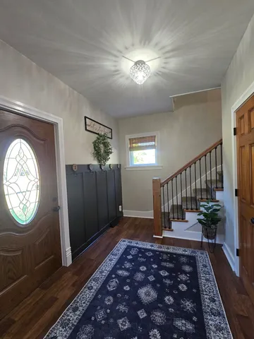 a view of entryway with wooden floor