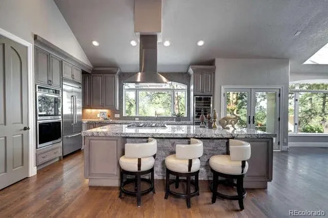 a kitchen with a table and chairs