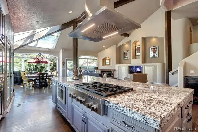 a kitchen with a stove and cabinets