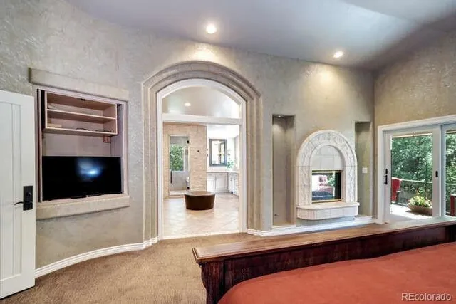 a view of hall way with furniture