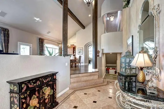 a view of living room kitchen and entryway